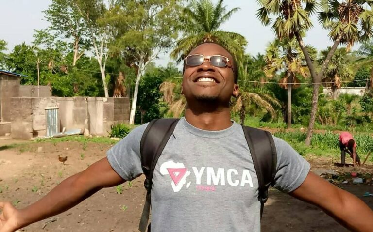 A happy man wearing a YMCA tshirt